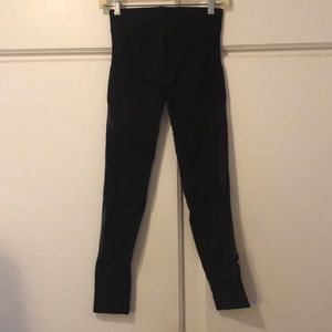 Stretchy black leggings with fish net sides